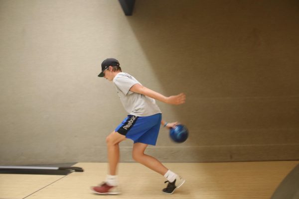 Unified athlete Tate Belveal bowls during practice at Royal Crest Lanes. 