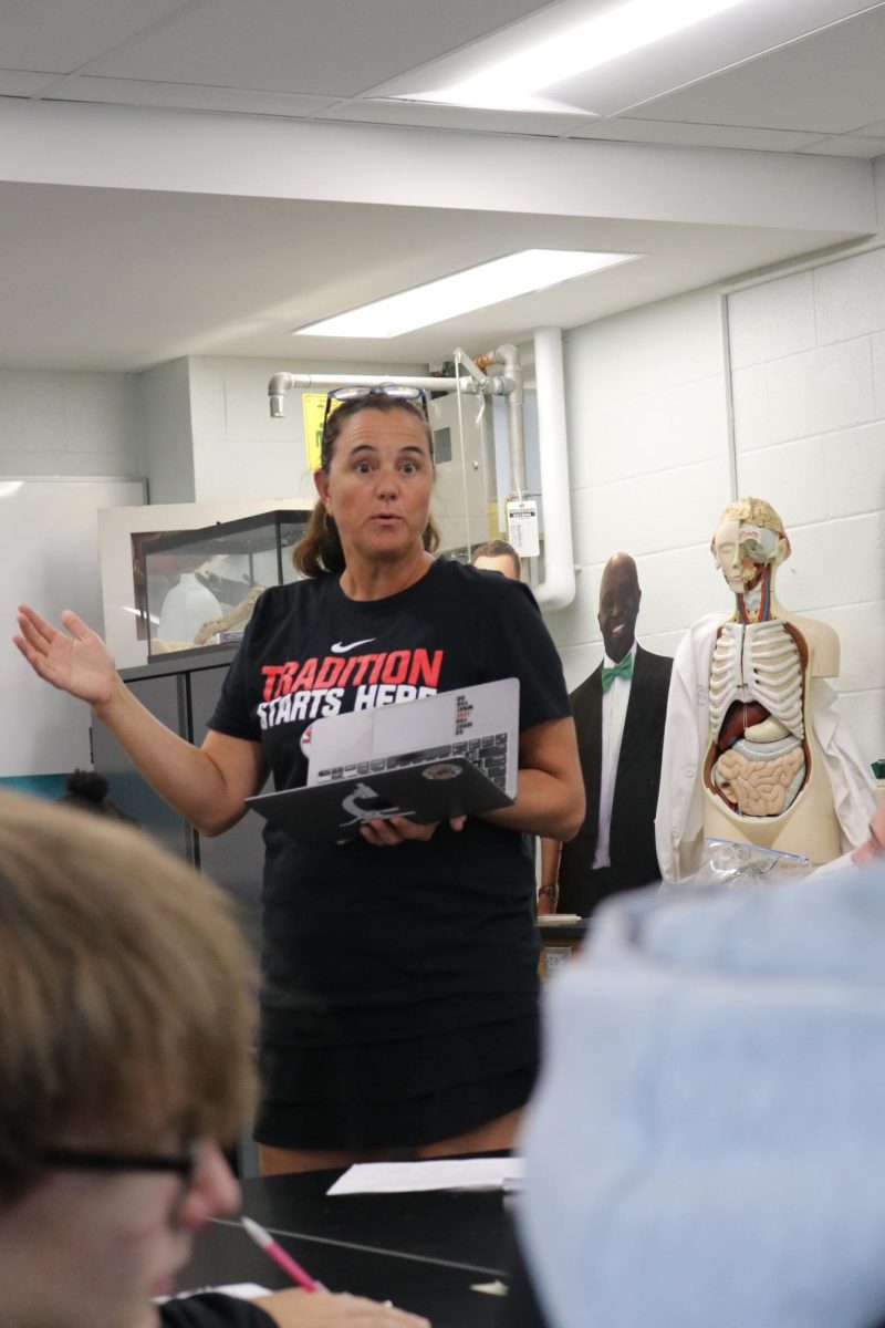 Lecturing, science teacher Marci Leuschen teaches an anatomy class. There are more and more classrooms being covered by teachers during their plan time and not subs, Leuschen said. 