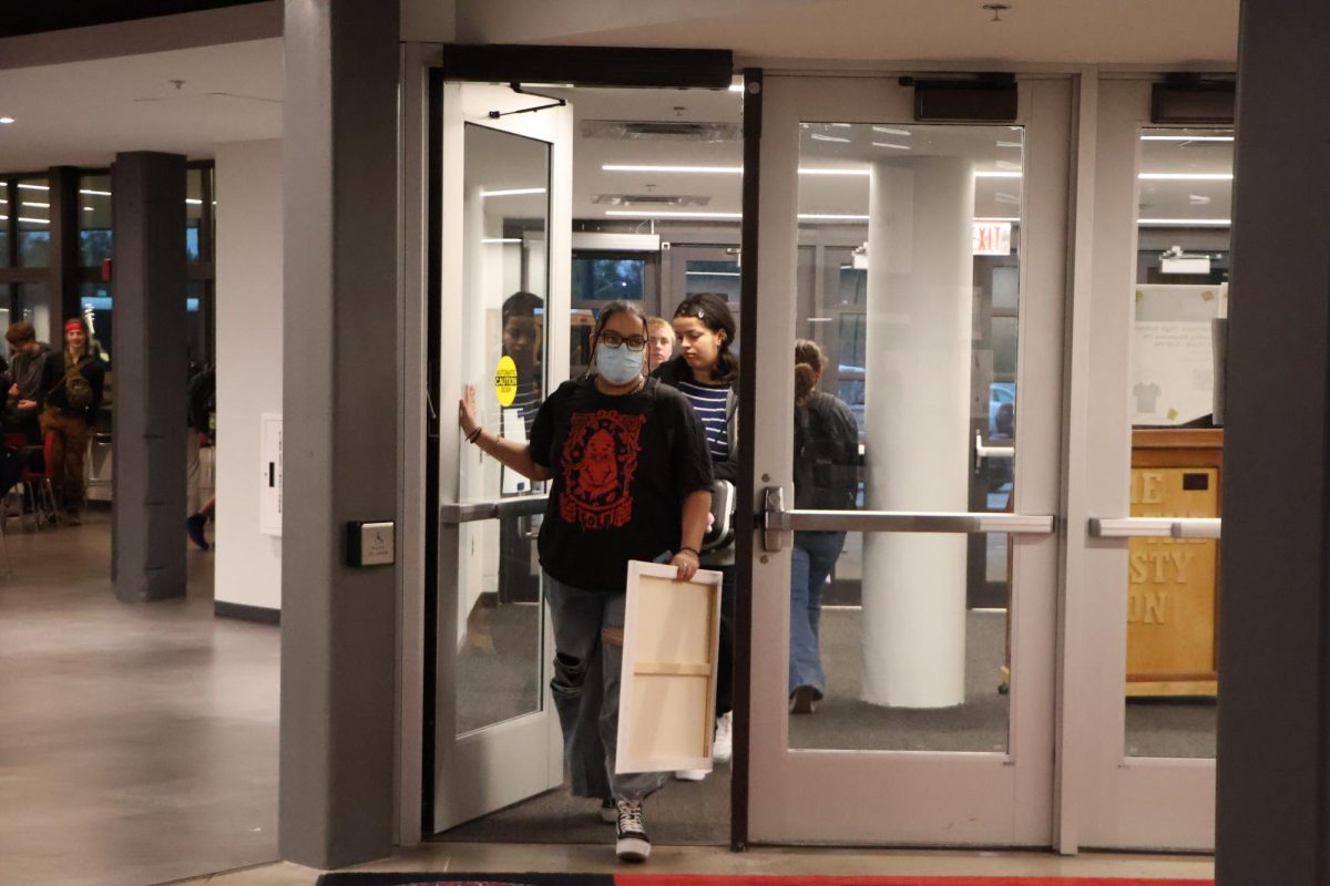 Walking through the door, students enter the building during the early hours of the morning. While student attendance rates have decreased, these students are to arriving early to get to class on time.