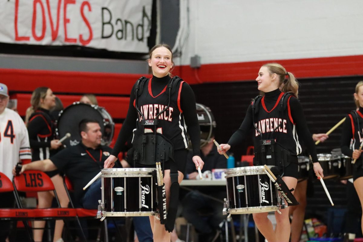 The pom team switches places with drum line.