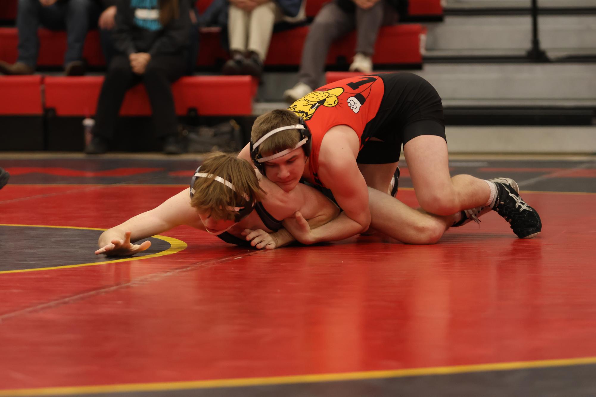 Senior Andrew Honas pins his opponent during a meet on January 24th at home.   