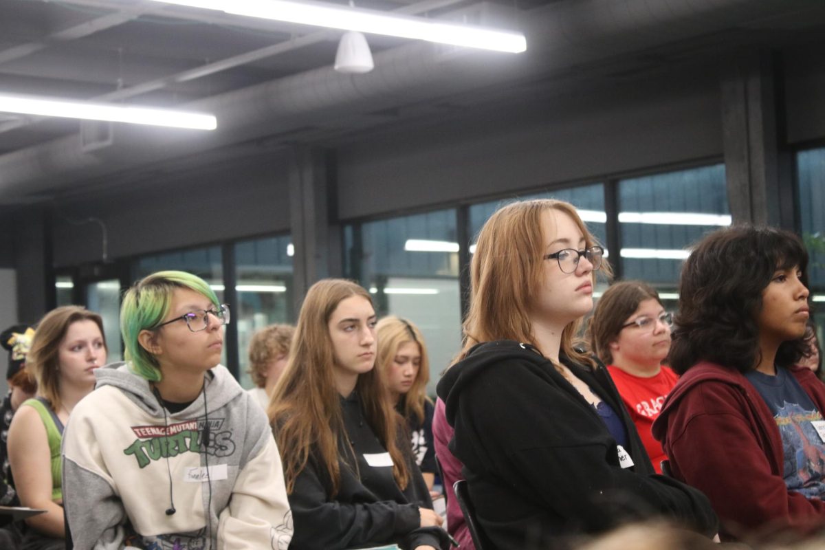 Art students listen to a presentation at portfolio day on September 22 as they prepare to pursue higher education. 