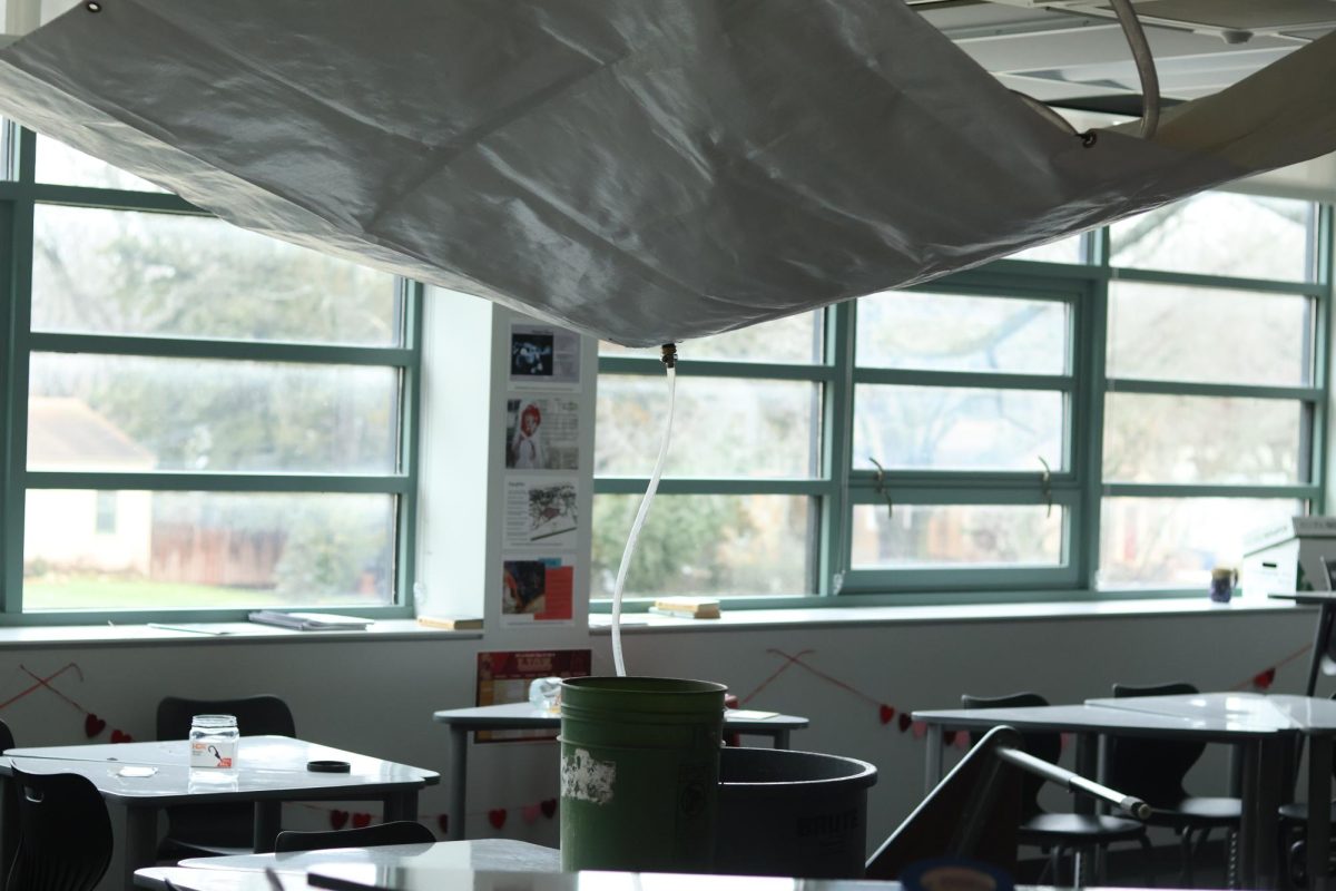 English teacher Melissa Johnsons original classroom, which since January has had a tarp catching water attached to the ceiling.