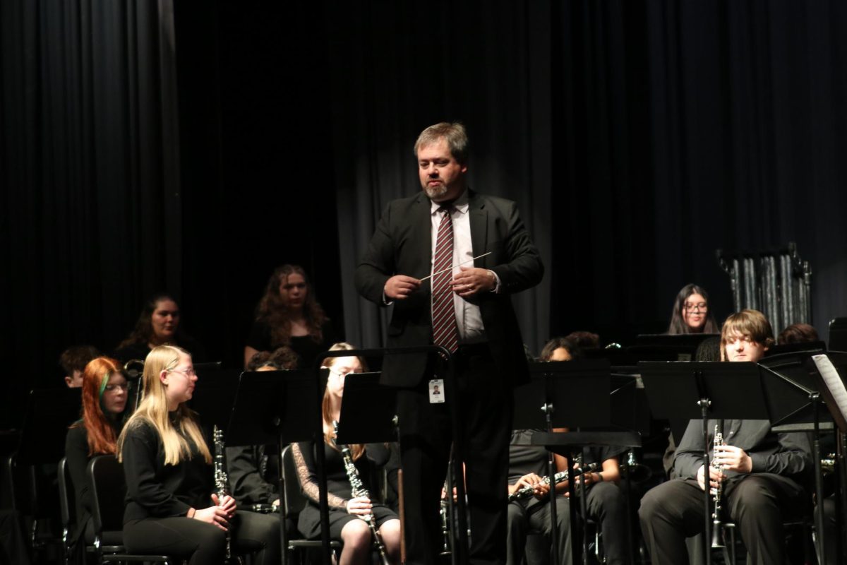 Tom Hunt directs the band during the concert on December 7. 
