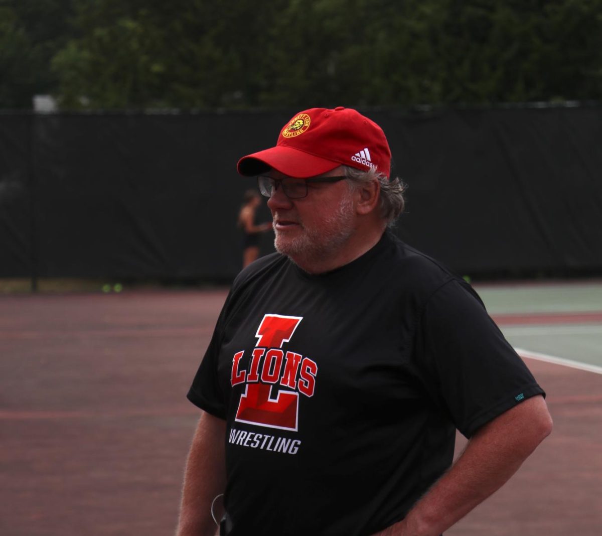 Assistant coach brings new energy to girls tennis